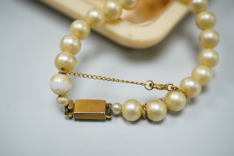 Two coral necklaces and a group of costume jewels, comprising: two coral bead necklaces, each with a gold clasp, combined gross weight approximately 35 grams; together with a simulant pearl necklace and pair of earrings